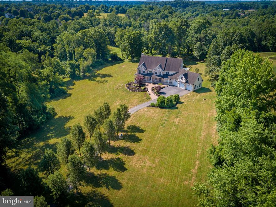 221 W Woodview Road demands your attention! This breathtaking custom-built home is privately situated on 14 acres in Chester County's beautiful West Grove farmland. The home was built in 2009 with over 5,500 sqft of living space, oversized 3 car garage, large back patio and deck with a saltwater inground pool. Upon entering the home, you will find a spacious foyer, private office, open dining room and a grand kitchen; find everything from a 6 burner Viking stove and stainless steel appliances to a high bar for 6 on the island. Excellent for parties or gatherings, small and large! Off the kitchen you will find a welcoming sun room and an additional living room! Many of the rooms boast large windows with an abundance of natural light from the southern exposure. There are a total of 5 bedrooms, and 4 full bathrooms, (plus 2 powder rooms). Upstairs, you will find 4 of the spacious bedrooms, including the primary suite, an extra room and two attics spaces for storage. As a bonus, the property's original cottage house is still located on the 14 acres and is awaiting a charming restoration with potential to be used as a short or long term rental! This parcel is completely private though conveniently located near 41 and ; with quick access to West Chester, and Philadelphia. Do not miss this rare opportunity to acquire 14 beautiful acres in West Grove! ** Please note that this property is owned by London Grove Township. Offers will be reviewed on Sep 11, 2024 **