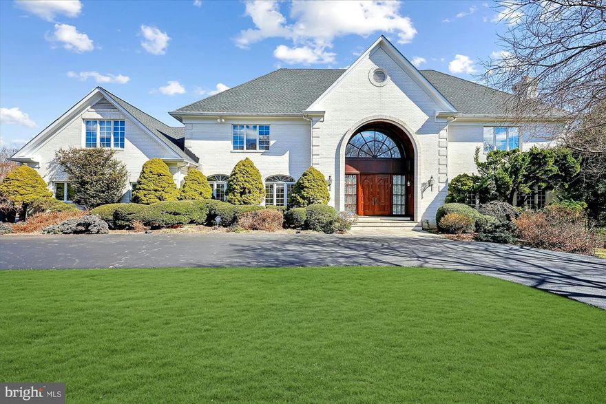 Discover 12405 Bacall Lane, nestled on a serene cul-de-sac in one of Potomac’s most desirable communities. Set on an expansive 2-acre lot, this home seamlessly blends indoor and outdoor living with multiple access points to the deck and backyard. Outdoor spaces are equally impressive, featuring a flagstone patio, large deck, and a sprawling yard perfect for relaxation and entertaining. NEW ROOF (2016), NEW EPOXY GARAGE FLOOR (2025), BASEMENT WATERPROOFED (2023).
This beautifully presented 8,555-square-foot home showcases elegant finishes alongside modern amenities. Design highlights include a grand two-story open foyer, artisan millwork, hardwood floors on the main and upper levels, two fireplaces, built-in shelving, recessed lighting, skylights, a sun-drenched sunroom, oversized rooms, and stately Palladian windows throughout, an attached 3-car garage, and more! An 800+ square foot upper-level bedroom/bonus room and a walk-out basement provide even more versatile living space.
The eat-in kitchen, adjacent to the family room, features a center island with cooktop, double wall oven, quartz countertops, crisp white cabinetry, and a sunny breakfast area with direct deck access. The main level also offers formal living and dining rooms, a private office, a sunroom, two powder rooms, and a convenient mudroom/laundry room with garage entry.
Upstairs, discover five spacious bedrooms and three full bathrooms, including a spectacular 1,000+ square foot primary suite. The suite features a sitting area, two walk-in closets, and a luxurious en-suite bathroom with marble tile surround, dual vanities, a soaking tub, and a separate shower. The expansive bonus room/5th bedroom offers endless possibilities — perfect as a second bedroom suite, playroom, exercise space, artist’s studio, or media room.
The walk-out lower level offers flexible living space ready to be finished to your taste, adding even more potential to this already exceptional property.
Ideally located with easy access to major commuter routes, this home is close to parks, recreational options, and nationally rated golf courses — ideal for outdoor enthusiasts. Top-rated Montgomery County schools further enhance its appeal.
Don’t miss this incredible opportunity to own in one of the DC area’s most sought-after communities!