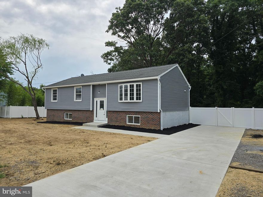 Discover the charm of 157 Jarvis Rd, a beautifully renovated gem on the sought-after Gloucester Twp side of Sicklerville. This home offers an ideal blend of modern luxury and classic comfort with 5 bedrooms and 3 full bathrooms, perfect for today’s lifestyle.

Key Features:

- Spacious Layout: The upper level includes 3 beautifully appointed bedrooms and 2 full bathrooms, featuring a master suite with a spa-like ensuite bath and his-and-her closets. The lower level provides 2 additional bedrooms, another full bathroom, a generous family room, a private laundry area, and an additional utility room—ideal for guests, extended family, or a home office.

- Contemporary Kitchen: Enjoy a modern kitchen with sleek quartz countertops, all-new stainless steel appliances, and a versatile closet that can serve as a pantry.

- Natural Light: Skylights in the kitchen and upper-level bathrooms fill the spaces with abundant natural light.

- Enhancements: Newly installed driveway, stylish new flooring, fresh modern paint throughout, recessed lighting with dimming options, and a brand-new fence.

- Outdoor Living: Expansive two-tiered deck and a fully fenced-in backyard—perfect for summer barbecues and all year outdoor gatherings.

- Expansive Property: Beyond the fully fenced backyard lies an additional wooded lot, providing a serene natural extension to the property. Please refer to the property survey.

Conveniently located near shopping, dining, and major highways, this home offers both luxury and practicality. Don’t miss your chance to own this exceptional property—schedule your showing today and experience its beauty firsthand!