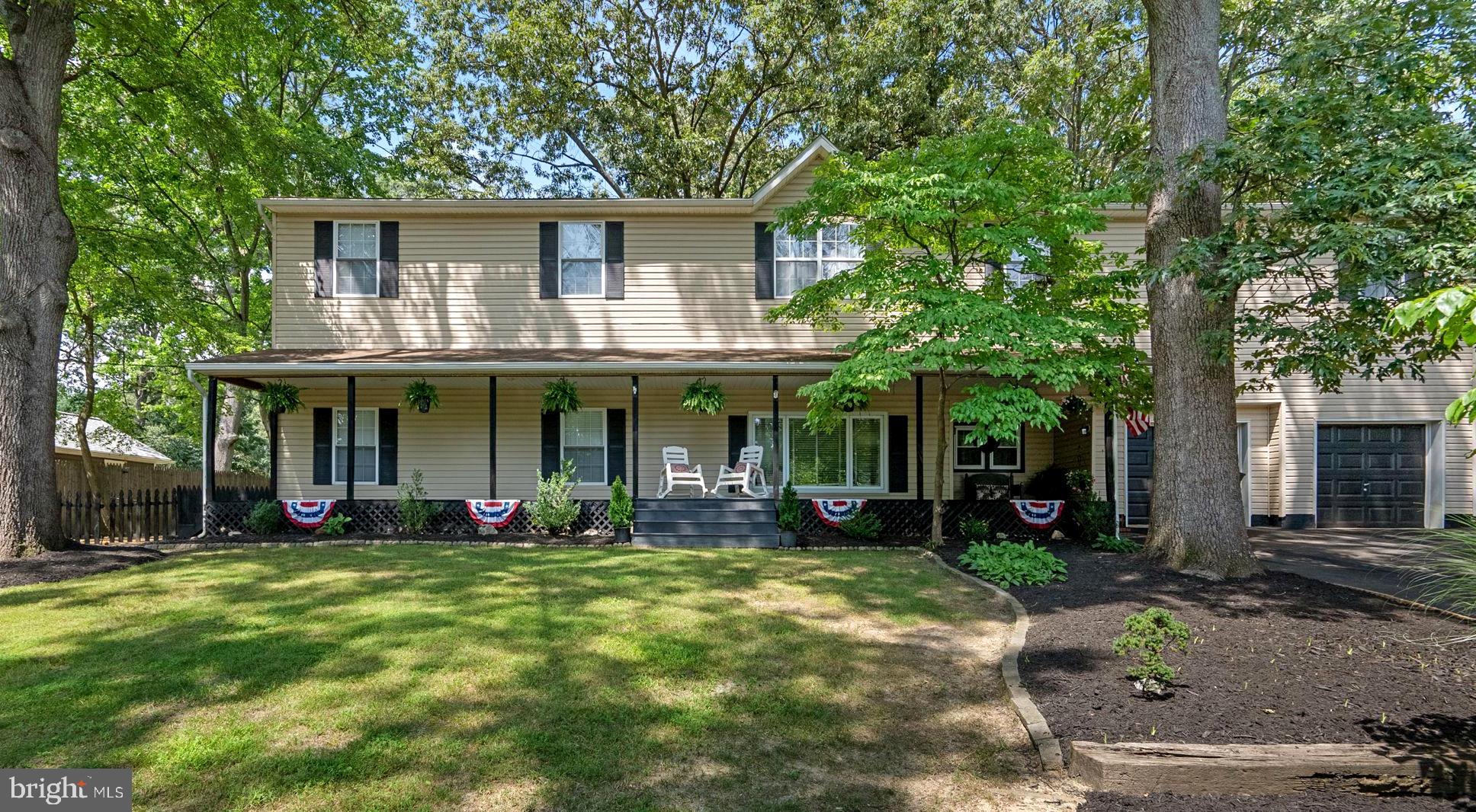 Welcome to this charming multi-Generational home in water priviledged Hollywood on the Severn! Thoughtfully designed for modern multi-generational living, you'll love this expansive and versatile home with over 3,900 square feet of finished living space. This beautifully maintained property offers comfort, space, and privacy across three distinct living areas—all nestled in a tranquil, tree-lined neighborhood. The main level features a spacious primary suite with walk-in closet and ensuite bath, a dedicated home office, and elegant formal living and dining rooms—ideal for entertaining. The updated kitchen boasts a breakfast bar and flows seamlessly into a cozy breakfast nook and bright sitting area, creating a warm central hub for daily life. A large laundry room and an additional full bath complete the main floor. Upstairs, you'll find three generously sized bedrooms, a full bathroom, and a large family room, perfect as a media space, playroom, or teen hangout. With its own private entrance from the main-level garage, the in-law suite lives like a separate apartment—ideal for extended family, guests, or rental income. It features a full kitchen, living room, bedroom with walk-in closet, and full bath, plus a second-story bonus space that adds flexibility for work, relaxation, or additional storage. The unfinished basement (14’1” x 28’1”) offers endless possibilities for a home gym, rec room, or extra storage. Two attached garages provide ample space for vehicles, hobbies, or a workshop. Step outside to a professionally landscaped backyard retreat. Enjoy a multi-level deck, custom hardscaping, serene patio, firepit area, and mature trees offering natural shade and privacy. Whether you're entertaining a crowd or enjoying a quiet evening, this outdoor space is a true showstopper. Additional highlights include covered front porch with charming curb appeal, tasteful finishes and abundant natural light throughout, flexible layout with multiple living areas. Located just blocks from the community water access, beach and pier! Close to local shops and restaurants, Blue Ribbon schools, Kinder Farm Park, and commuter routes, this rare and well-designed property ideal and offers unmatched flexibility for multi-generational households, those seeking rental potential, or anyone simply looking for space to spread out and enjoy both indoor and outdoor living. Schedule your private tour today!
