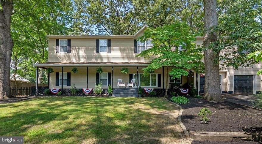 Exquisite multi-generational home in water-privileged Hollywood on the Severn
Welcome to a beautifully maintained and thoughtfully redesigned residence, perfect for modern multi-generational living. Located in the highly sought-after Hollywood on the Severn community, this versatile and expansive home offers a serene, tree-lined setting just blocks from community water access, a beach, and a pier.

Key features: Property size: A generous 5,170 square feet of finished living space on a
0.39-acre lot Bedrooms: 6 Bathrooms: 4 full and 1 half 

Year built/renovated: Built in 1958, this home was redesigned in 2006 to accommodate flexible living arrangements.

Interior: The home features a main level with a primary suite, updated kitchen, formal living and dining rooms, a home office, and a laundry room. The upper level includes three bedrooms, a full bathroom, and a large family room. A separate in-law suite with its own entrance, kitchen, living room, bedroom, bathroom, and bonus space provides flexible living options.

Exterior: The outdoor space includes a professionally landscaped backyard with a multi-level deck, hardscaping, and a firepit area. A patio and covered front porch enhance the home's appeal.

Additional amenities:
Parking: A two-car attached garage.
Community access: Water privileges with access to a beach, picnic area, and pier.
Location: Close to schools, parks, shops, restaurants, and commuter routes.

This unique property offers unmatched flexibility for multi-generational households or anyone seeking ample space for indoor and outdoor living.

Contact us today to schedule your private tour!