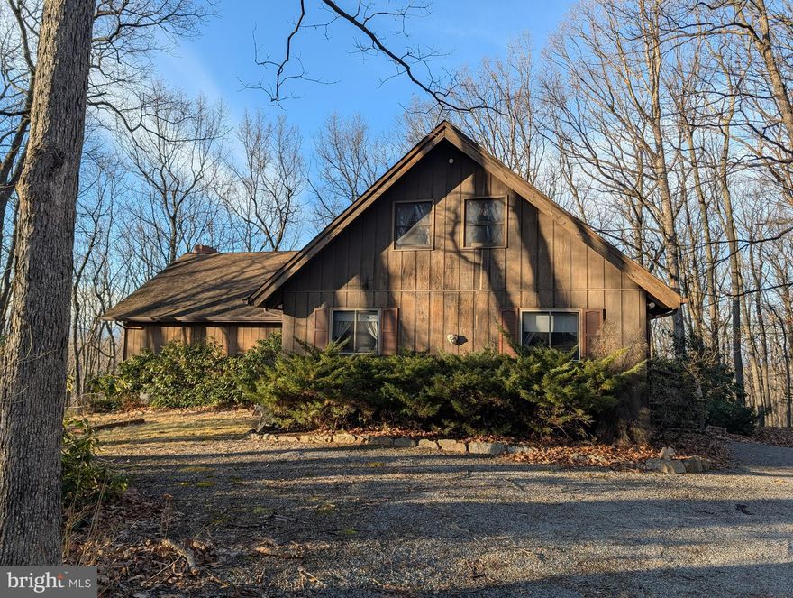 Experience peace and privacy in this secluded 3-bedroom, 3-bathroom retreat nestled on over 12 wooded 
acres in Bedford. This 4,551 sq. ft. home features an eco-friendly geothermal system and a furnace 
updated 6 years ago for year-round comfort. The interior boasts durable tile in the kitchen and bathrooms, 
complemented by well-maintained carpeting throughout. Outside, you’ll find a detached carport with a 
durable metal roof and a spacious shed for all your storage needs. Complete with a functional kitchen and 
included appliances, this property is a tranquil mountain-lodge getaway.