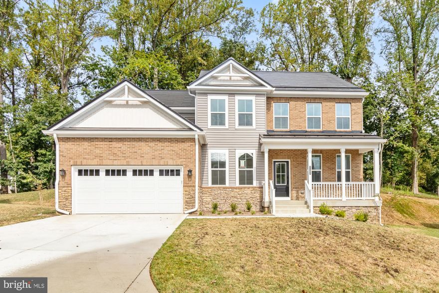 Luxurious 6-Bedroom Beazer Home with Tesla Solar Package and Private Wooded Backyard

Welcome to this exceptional new home built by Beazer, offering modern elegance and energy efficiency with a Tesla Solar Package. This stunning 6-bedroom, 4-bath home features a charming front porch and a two-car garage. Step inside to find an inviting entry with LVP flooring, a dedicated office, and custom touches like crown molding throughout. The formal dining room is adorned with wainscoting and includes a butler's pantry with a second dishwasher, perfect for entertaining.

The heart of the home is the gourmet kitchen, showcasing white shaker cabinets, a double wall oven, cooktop, and an oversized island. Sliders lead out to the private, wooded backyard, providing serene views and tons of natural light. The kitchen flows seamlessly into the family room, complete with a cozy fireplace, creating the perfect space for gatherings. A first-floor bedroom with a full bath and walk-in closet offers flexibility for guests or multigenerational living. The convenient mudroom is located off the garage.

Upstairs, enjoy a versatile loft space, ideal for relaxation or play. The primary suite boasts coffered ceilings, recessed lighting, a walk-in closet, and a luxurious en suite bathroom with a double vanity, soaking tub, and stand-up shower. Three additional bedrooms, a full hall bath, and a laundry room complete the upper level.

The finished lower level offers even more living space, with sliders to the backyard, a spacious bedroom with walk-in closet, a full bathroom, and a large storage room.

This home is the perfect blend of elegance, comfort, and energy-efficient living in a tranquil setting. Don't miss the opportunity to make it yours!