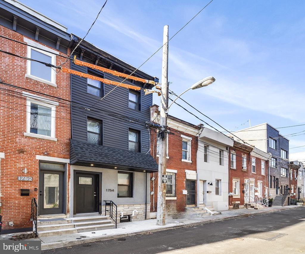 Welcome to 1754 Waterloo Street on the border of the popular Olde Kensington neighborhood where it meets vibrant Fishtown, a stone's throw from the hustle and bustle of Frankford Ave. This recently renovated townhome features THREE generously sized bedrooms and TWO full luxurious bathrooms. Upon entering you are greeted by an open layout finished with warm luxury vinyl flooring that's throughout the home, exposed brick and a gorgeous state of the art kitchen with floating shelves, stainless appliances, quartz counters, island seating and a wine refrigerator to accommodate your favorite beverages. To the rear is a private patio space perfect for alfresco dining and an extension of living space in the warmer months. The 2nd Floor houses two bedrooms each with their own closet as well a spacious hall bathroom with a glass enclosed shower and a convenient upper floor stacked washer/dryer. The entire 3rd floor is the primary suite with a large walk-in closet and spa-like bathroom including soaking tub and large custom-built shower. This home is a must see and the location can't be beat with many conveniences and neighborhood hot spots just steps away. WalkScore is 89 meaning most daily errands can be done on foot. The location also makes commuting a breeze with easy access to public transportation including the Market-Frankford Line (a quick 2 block walk) in addition to numerous bus routes and I-95 access within several blocks. This great home is ready for you to move right in and enjoy!