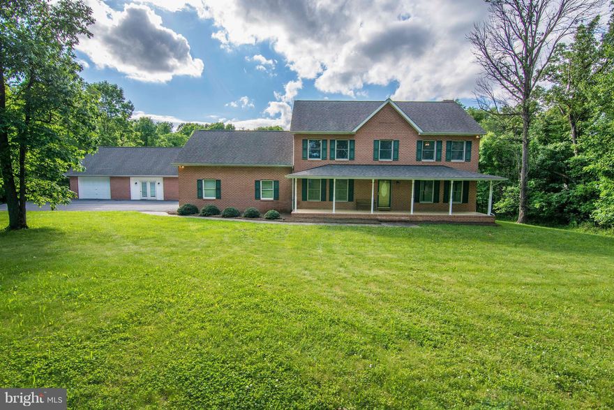 Large all brick colonial minutes from 1-81 surrounded by orchards. Large kitchen overlooking the family room with propane fireplace. Hardwood floors throughout the main level. The finished basement has it's own kitchen, full bath and laundry. The detached garage is ready to use as an additional living space or office with a full bath.