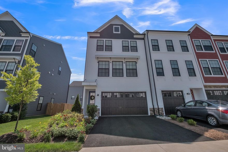 Better than new, this end unit townhouse in Prosperity Plains is less than 2 years old.  If you missed the opportunity to build, here is your chance to get a move-in ready, custom designed and beautifully appointed Carver model.  Plantation shutters on all windows, custom entry welcome center, board and batten designs, just scratch the surface of what this professionally decorated and meticulously maintained home offers.  Enter this home to a downstairs entertaining space featuring a bathroom and mudroom.  The main level boasts an open concept living space with a beautifully designed kitchen, featuring top of the line options and finishes.  The top level includes three bedrooms and two full baths.   Outdoor entertaining flows from the main living space to the rear deck seamlessly.  A must see and rare opportunity in the sold out Prosperity Plains community!