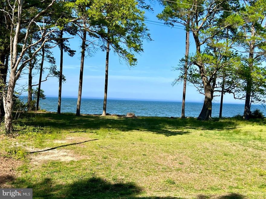 VIEWS, VIEWS, VIEWS ! It gets no better than this where you have Potomac/Bay and Beach views on one side and Lake/pond views on the other ! Also – it is like living Beach-Front with the private community beach just a few steps away ! Check out this parcel and the adjoining parcel (lot 164- priced at $80,000) to see why this might be an absolute Gem Location to Build your Dream Home ! In a wonderfully well kept neighborhood with impressive amenities.