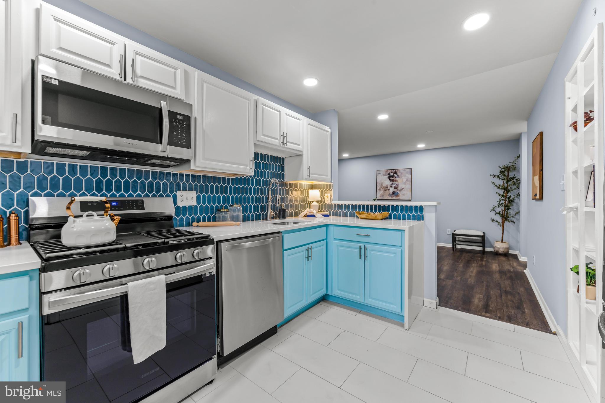 Welcome to this beautifully renovated condo located in a secure, gated community that combines comfort, style, and convenience. This home boasts modern upgrades throughout, including LVT flooring throughout, a large kitchen with stainless steel appliances, a modern blue backsplash, duo tone cabinetry, quartz counters, a master ensuite that includes all new tile, vanities, toilets, flooring and more – every detail has been thoughtfully refreshed for today’s lifestyle. Step outside and enjoy the community’s serene, family-friendly outdoor spaces, perfect for relaxing, socializing, sitting poolside or biking. Take a short stroll to Springlake Way’s iconic Koi Pond, a beloved neighborhood gem. Ideally situated just minutes from I-83, this location offers unbeatable access to Johns Hopkins University, University of Maryland – Notre Dame, Loyola University, and more. Whether you're a professional, student, young family or someone seeking a peaceful yet connected place to call home, this condo checks all the boxes. Schedule your private tour today!
