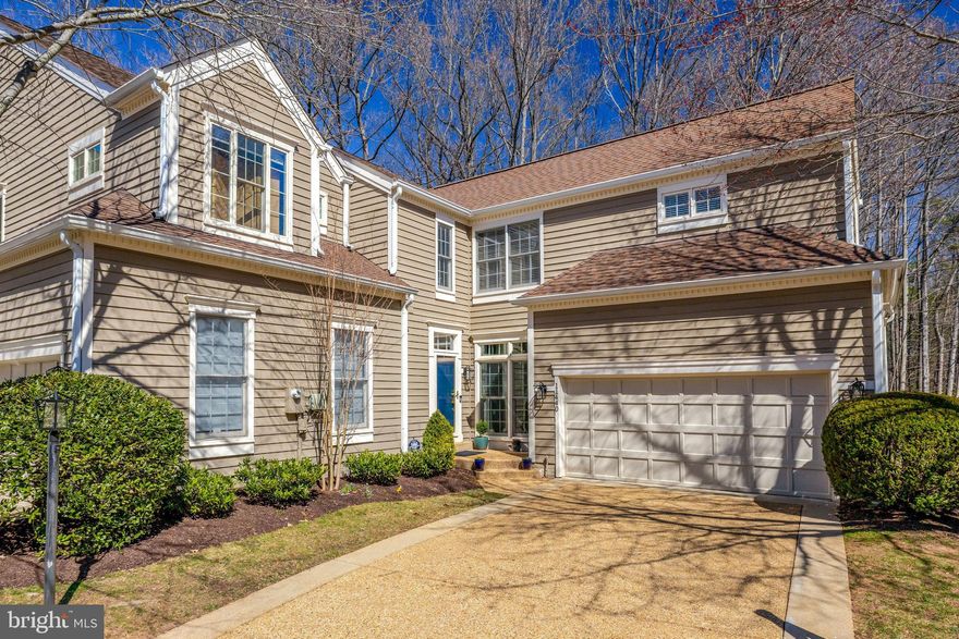 Situated in one of Reston’s most sought-after clusters, Timberview, this end-unit Z Lot Line Cedar Model offers abundant light, space, privacy, and modern updates. With over 3,000 sq. feet of finished space, this home has  3 bedrooms on the upper level, 1 additional bedroom on the lower level, 3 full and 1 half baths, and a 2-car garage. This meticulously maintained home seamlessly blends comfort and convenience.

The main level has been completely reimagined for an open, airy feel. Walls were removed to create a spacious, gourmet kitchen featuring a large island, Thermador professional range, and easy access to a remodeled Trex deck — perfect for outdoor dining. The family room, with its cozy gas fireplace, offers warmth and charm, while the separate living room provides a more formal gathering space. A stylishly remodeled powder room completes this level.

Upstairs, you’ll find three well-sized bedrooms, each filled with natural light. The primary suite stands out with vaulted ceilings, serene wooded views, two closets, and a renovated ensuite bath with a walk-in shower and double sink vanity. An upper-level laundry room adds convenience.

The lower level offers incredible flexibility, featuring a spacious recreation room with a second gas fireplace and access to a flagstone and brick patio. A separate bedroom is perfect for guests or a home office, while the full bath, wet bar area, and large finished room offer additional space for storage, crafting, or a home gym.
Located in the desirable North Hills area of Reston, this home is close to picnic pavilions, pools, Lake Newport,  tennis/pickleball courts, and endless walking trails. Commuters will appreciate easy access to major routes, Reston Town Center, and the Metro. With its prime location, updated interior, and versatile living spaces, this Timberview gem truly has it all — the perfect balance of style, comfort, and Reston charm.  *** Key Updates***2025-Washer/Dryer / Refridgerator--2024-LL Wet Bar Area/Storage Craft Room/ Hardood Stairs to upper level-2023- Trex Deck--2021- Main Level Resigned and Kitchen Remodeled--2019--Insulated Garage Door & Opener, Powder Room --2017- Primary Bath--2015, Roof, Gutters/Downspouts/Leaf Guards,--2012- HVAC, Water Heater -- 2009- Flagstone Brick Patio--MULTI Year- Majority Windows Replaced w/ Renewal By Andersen Replacement Windows***