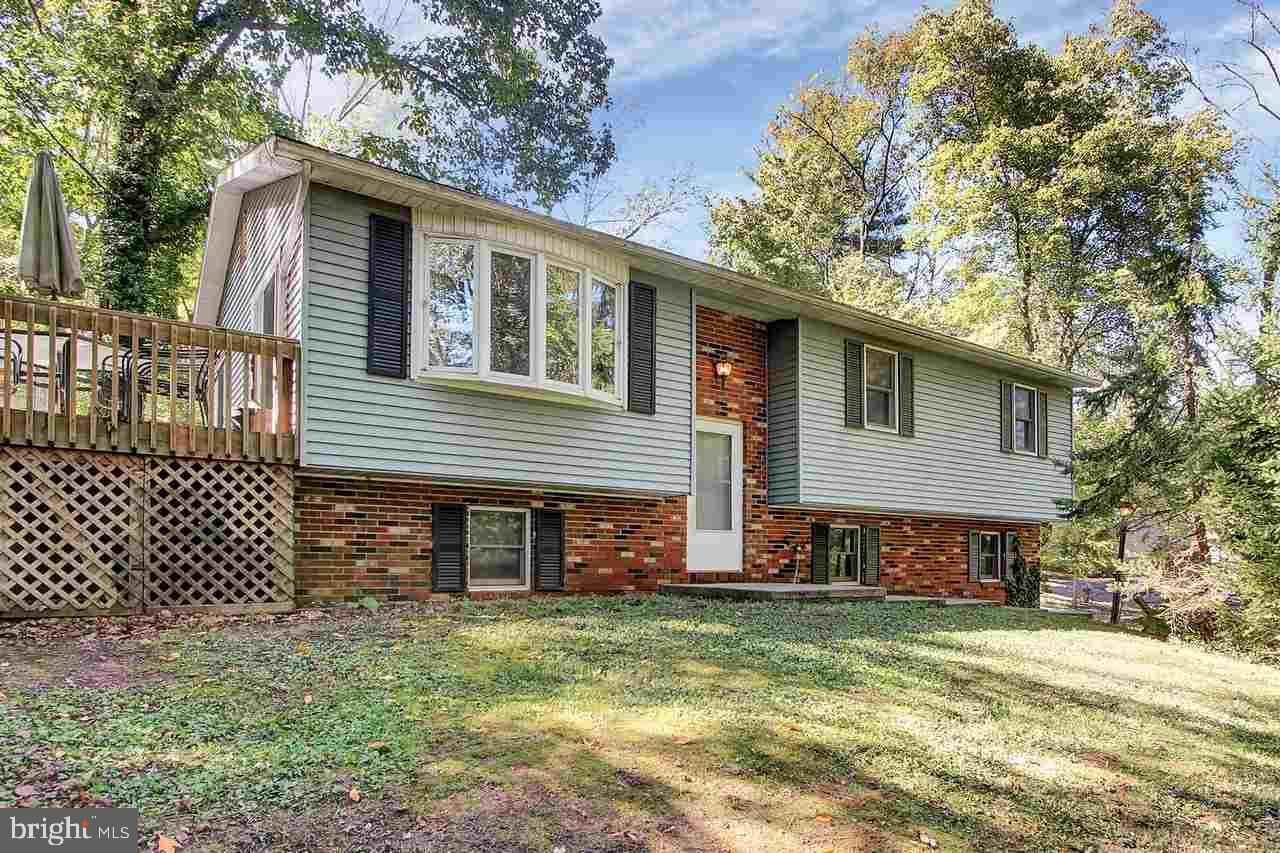 Secluded Bi-Level in Beautiful Fishing Creek Valley! Country Setting, but Close to Everything. 3 BR w/ Possible 4th in Basement. 3 Full Baths! Spacious Kit w/ Peninsula Open to Dining Area. 2 Sliders Lead to HUGE 24'x13' Deck with Custom Benches, Ramp & Access Door to Basement. Spectacular FR in LL w/ Bar, Full Sink & Pellet Stove That Can Heat Entire House. Enjoy the Deer & Turkey in Your Own Private Backyard. USDA Eligible. This is Home.