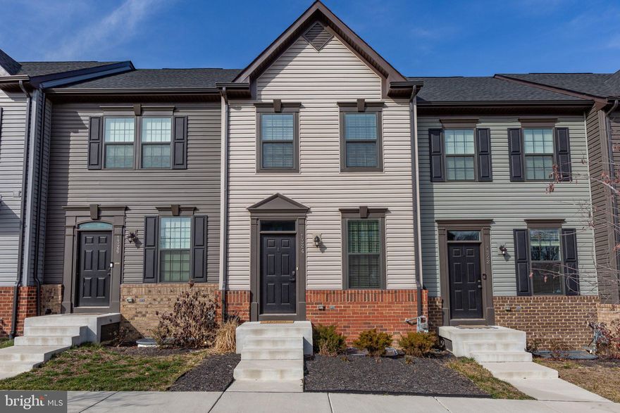 Stunning Townhome located in Fredericksburg.  Home features an open concept floor plan with three finished levels and a spacious garage.  The main level has a large living room that opens to the kitchen and dining area.  The kitchen features a breakfast bar, island, quartz countertops, soft-close cabinets, stainless steel appliances, gas oven/range, pantry, and plenty of countertop and cabinet space.  From the kitchen/dining area you can walk out to a spacious composite deck.  The upper level features a spacious primary bedroom with two closets and a primary bathroom that has a double vanity sink and shower. The upper level has a second bedroom, full bathroom, and laundry area with washer and dryer.  The lower level has a large family room, half bathroom, and attached garage.  The main and lower level feature luxury vinyl plank flooring.  Home is conveniently located close to the VRE, parks, walking/biking trails, shopping, restaurants, and I-95!  This is a must see!