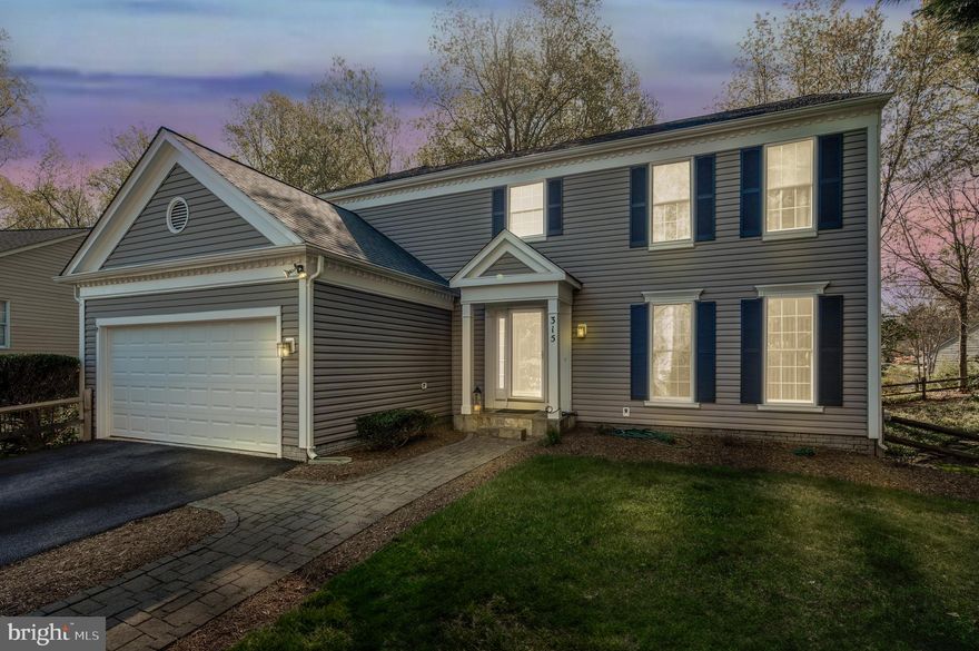 Welcome to 315 Rosslare Drive, where comfort, style, and privacy come together in perfect harmony. Tucked away on an extended driveway and set back from the road, this stunning 4-bedroom, 3.5-bath home offers a quiet retreat while keeping you close to everything you need.  Step through the front door into a bright and open foyer with gleaming hardwood floors and elegant touches like chair rail molding and decorative columns that frame the living room. Just off the foyer, a large formal dining room offers the perfect setting for gatherings and special occasions. The custom neutral color palette gives the home a clean, fresh look that’s easy to personalize. 
The heart of the home is the gourmet kitchen, featuring upgraded countertops, rich cabinetry, and a layout that flows seamlessly into the adjoining family room. Soaring ceilings and oversized windows fill the space with light, making it perfect for relaxing or entertaining. Upstairs, you'll find spacious bedrooms, including a large primary suite with a cozy sitting area, huge walk in closet and luxury bath which includes a large walk in shower, and dual sinks.   The fully finished lower level adds even more space with a large rec room, a 4th bedroom, and a full bathroom—ideal for guests, hobbies, or movie nights. The walk-out basement leads to a peaceful, private backyard, surrounded by nature and ready for gatherings, play, or quiet mornings with coffee. 
Enjoy the best of both worlds: a tucked-away location that still offers quick access to shopping, dining, walking trails, and major commuter routes to Annapolis, Baltimore, and DC.

Don't miss your chance to own this beautifully upgraded home in one of the area's most convenient and desirable spots. 315 Rosslare Drive is ready to welcome you home!