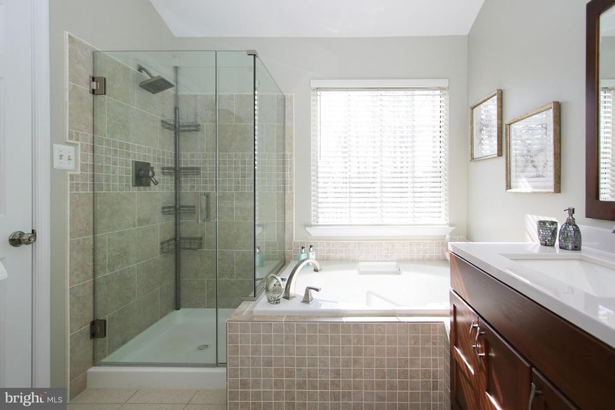 Top to bottom renovation on premium lot backing to woods and stream- New Roof * New Deck*Sunny Kitchen stone counters ,island seating,SS Appliances.Brand NEW Amazing Spa-like Master Bath,Granite Counters, Seamless Glass Shower . Plus 2 Updated guest baths +powder room- beautiful d cor paint, new lighting Fully Finished Walkout LL- 4th BDRM + Full Bath. N MORE New Stone Path Leads to Trail &Pool