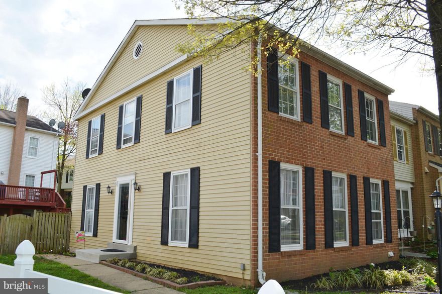 STUNNING end unit w/ 3 beds, 2 full 2 half baths, updated kitchen shines w/ granite and s/s appliances and walk out to beautifully appointed back yard w/ composite decking for entertaining. Sep dining room, large living room on main lvl, spacious rec room with fireplace in the basement, tons of storage. Brand new paint throughout, fresh and clean! tot-lot nearby  Come see and send an offer today!