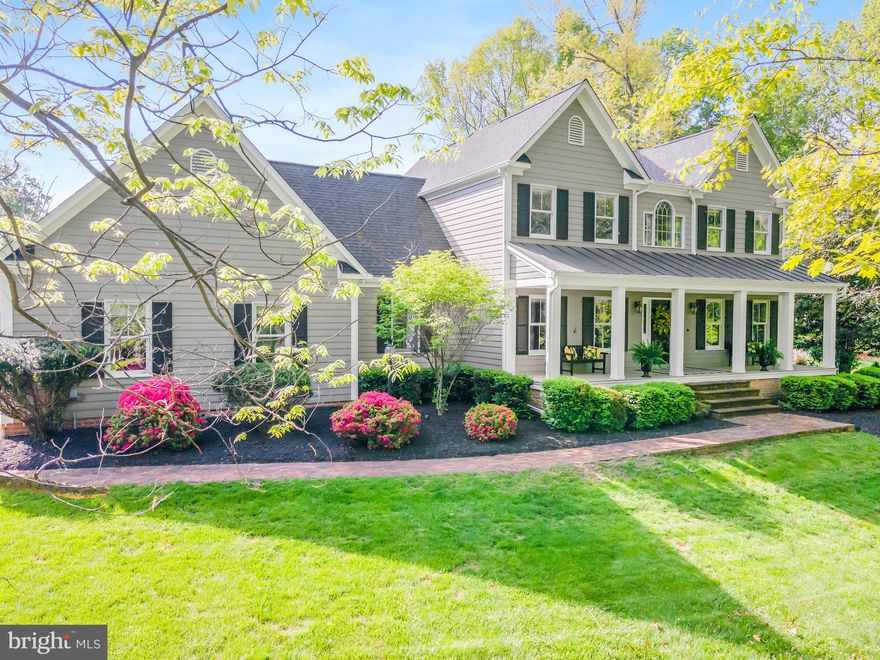 Nestled in the highly coveted Millpoint neighborhood of Martinsburg, WV, this Colonial gem is a testament to refined living. Boasting numerous upgrades, this 3-bedroom, 2 ½-bathroom residence sits on meticulously landscaped grounds spanning over 2 acres. The front porch, adorned with grand pillars and recessed lighting, sets a charming tone. Inside, the expansive kitchen, a host's dream, features granite countertops, custom cabinets, and updated appliances. Adjoining the kitchen is a spacious screened porch and decking that cascades down to a stone patio, complete with a secluded hot tub. The first floor offers a large den with a curved fireplace, a private office space with bespoke built-ins, and a cozy living room overlooking the lush front yard. Upstairs, three bedrooms await, including a master suite with a luxurious updated bathroom. Additional highlights include a generously sized garage with built-in amenities, recently rebuilt colonial cushwa brick walkways, and ample storage options including a walk-up attic. From the welcoming front porch to the serene screened back porch, every detail of this home beckons for effortless living and entertaining. Welcome home to comfort, style, and tranquility.