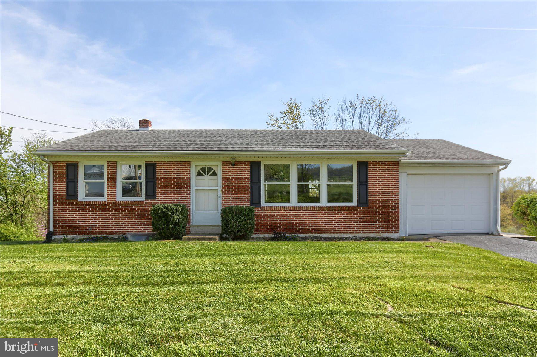 You'll love the quiet rural location yet it is close to major roadways making any commute a breeze.  This beautifully updated home offers a seamless blend of modern convenience and classic charm. As you step through the front door, the warm glow of refinished hardwood floors welcomes you into an inviting open floor plan, where every detail has been carefully curated for comfort and style.  The heart of the home is the newly renovated kitchen, boasting sleek granite countertops with a spacious center island, perfect for both casual dining and culinary creations. The open concept kitchen also enjoys a large dining area. The bath has also been completely renovated and fitted with hook-ups for the laundry.  Convenience meets functionality with main-level laundry facilities, ensuring effortless household chores. For added convenience, a one-car garage offers secure parking and storage space.  Descending to the lower level, you'll discover a versatile space with endless possibilities. The exposed unfinished basement, already plumbed for a full bath, presents an opportunity to customize and expand, creating additional living areas or entertainment zones to suit your lifestyle and preferences.  Outside, the surrounding area exudes tranquility, providing a peaceful retreat from the hustle and bustle of everyday life. With its perfect blend of modern comforts, thoughtful design, and serene surroundings, this updated home offers a harmonious balance of relaxation and convenience, ready to welcome you into a life of effortless living.
