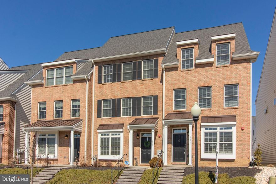 Location and style come together in this jaw-dropping Magnolia Place townhouse!  Just 5 years old and situated in a premier "WALK-TO LOCATION",  this beautiful showplace offers a carefree lifestyle and place you'll be proud to call home.   The community of Magnolia Place is conveniently located within walking distance to all the shops and restaurants that downtown Kennett Square has to offer,  as well as Victory Brewing Company and Canary Row, with its gourmet food shop, yoga studio, coffee shop and bakery.  As you step through the front door of this immaculate home, you'll be greeted by high ceilings, hardwood floors, moldings and upgraded finishes.   The large front LR flows into the DR, creating the perfect space for entertaining or flexible layout.   The kitchen was upgraded to include a stunning granite top island and elegant tile backsplash.  Appliances include a stainless gas range and refrigerator, a built in microwave and a stainless sink with disposal.   There is plenty of cabinetry and counter space for the most serious cook to feel comfortable working in.  A glass doorway leads to a private paver patio and fenced lawn, perfect for outdoor dining, grilling, gardening or simply relaxing .   A powder room and closets complete this level.  The 2nd level features the Master Suite with walk in closet, full bath with over-sized shower and plenty of space for your king-sized bed.   A 2nd bedroom is located at the opposite end of the hall and offers a huge walk in closet.  The 2nd floor hallway is where you will find both the laundry room and another full bath.  The 3rd level was an expanded upgrade to include a family room with full bath plus a 3rd bedroom with walk-in closet, perfect for overnight guests to have their own space.   Floored attic with pull down stairs provides plenty of storage space.  Additionally, the 3rd level family room provides walk out access to a spacious sundeck, perfect for relaxing or entertaining guests.   This home offers the upgraded 2 car garage.    Be sure to watch the video tour of this special home.