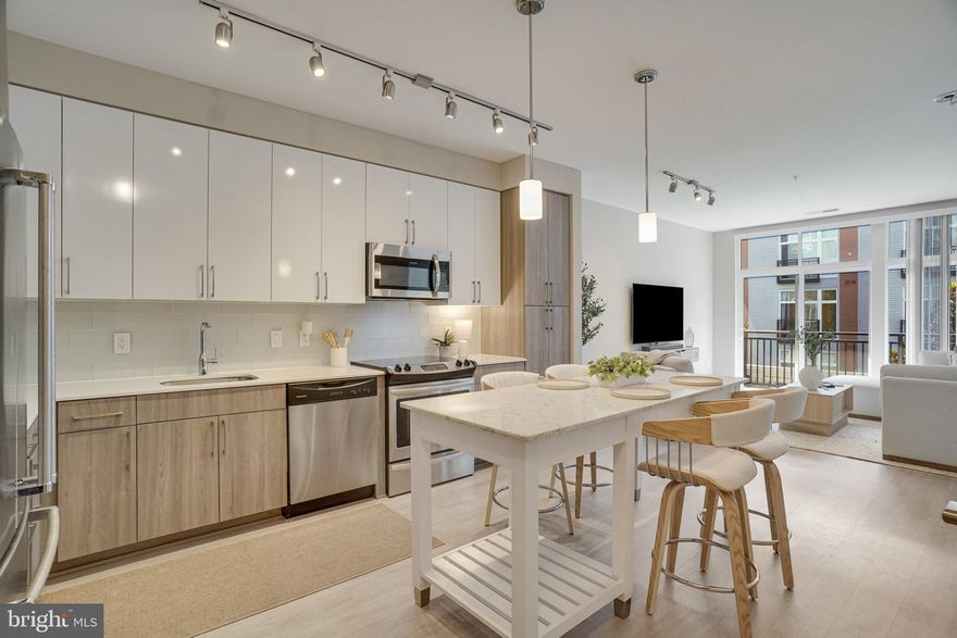 ***Motivated Seller!*** $15k price drop*** Qualify and get up to $50K for down payment and/or closing cost assistance. Welcome home to The Haven! This stunning, ultra-modern home features an open floorplan with gorgeous contemporary finishes and thoughtful storage - including a clever office nook created from a converted closet. The sophisticated, modern kitchen boasts on-trend two-tone cabinetry, stainless steel appliances, sleek granite countertops, and a classic subway tile backsplash. Luxury vinyl plank flooring leads you into the airy living room where a wall of windows fills the space with an abundance of natural light. The tranquil bedroom offers a zen-like retreat with ample closet space and a ceiling fan, while a spacious en suite bathroom features a wide vanity and stylish finishes. Step outside onto your private balcony to enjoy serene courtyard views while sipping your morning coffee or unwinding after a long day. In-unit laundry and reserved parking in a secure garage offer the height of convenience. Resort-like amenities in this desirable community include an on-site fitness center with separate yoga studio, outdoor pool, grill area, clubhouse, community and billiard rooms, pet spa station, temperature controlled secure bike storage, as well as a front desk concierge and 24/7 security including secure package delivery. Just minutes to National Harbor’s waterfront dining and shopping, Safeway, Target, Tanger Outlets, Old Town Alexandria, Joint Bases Andrews and Anacostia-Bolling, and The Pentagon. Quick access to I-495, I-95, I-295, and Indian Head Highway makes commuting and traveling around the DMV area a breeze. Schedule a private tour of your exquisite new home today!