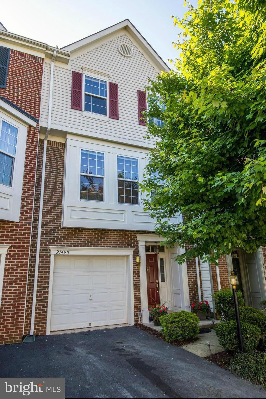 Garage townhouse in Sterling w/high ceilings, open floor plan & lots of light; updated in 2014.  Walk to shops, playground, pool.  New granite counters, paint, gleaming hardwood floors, carpet on lower level.  Master bedroom suite w/soaking tub, walk-in closet, peaked ceilings in bedrooms, deck, fireplace, walkout rec room to brick patio, fenced yard w/nice landscaping.  Open Sunday May 25, 1-4.