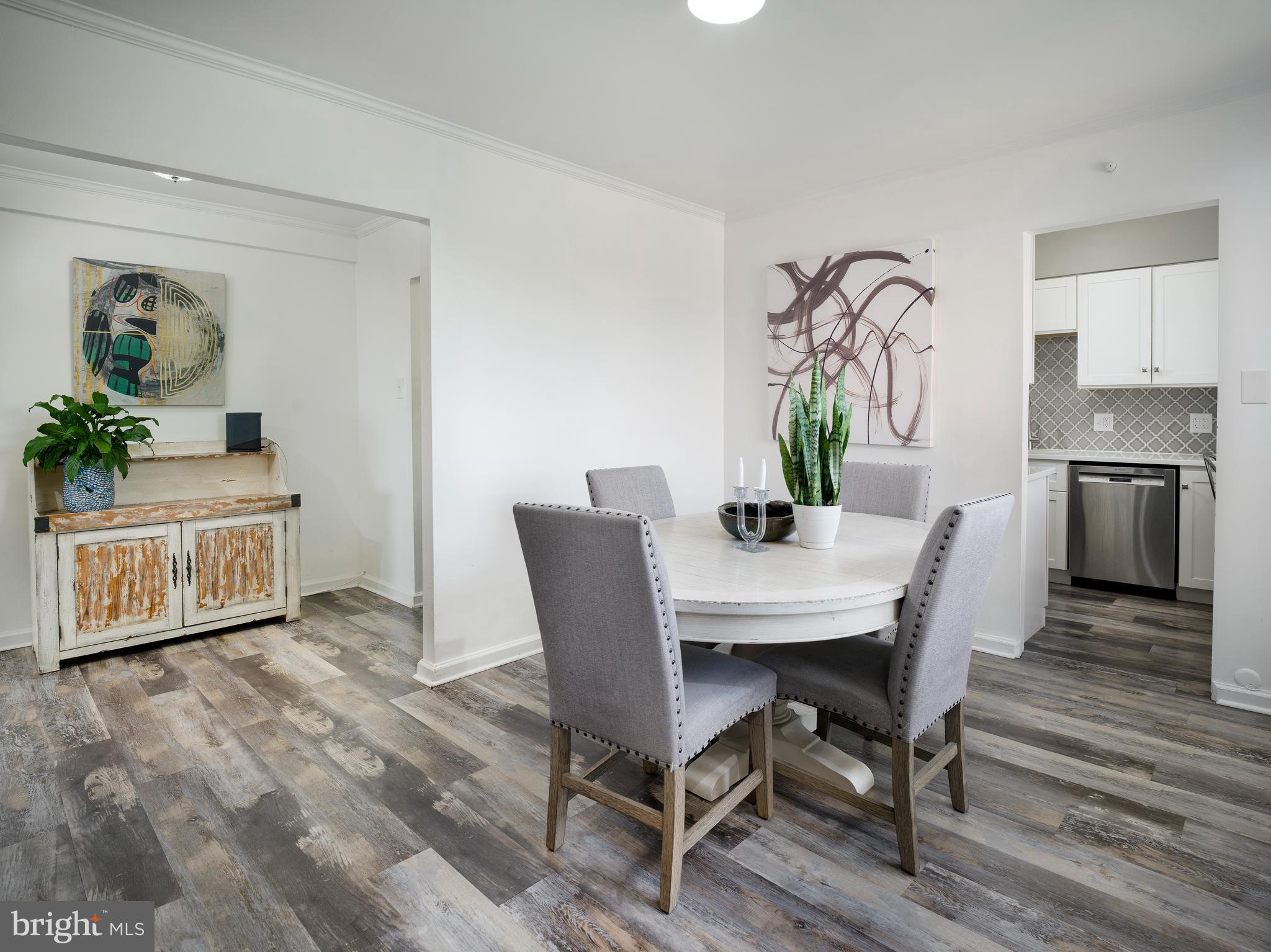 Experience top-floor serenity with skyline views at Latch’s Lane Condominiums. Welcome to Unit #605—an updated, light-filled residence offering sweeping treetop vistas, modern interiors, and unmatched convenience in the heart of Merion Station featuring an exceptional sense of privacy and quiet.
The open layout invites natural light and panoramic views of the Philadelphia skyline—especially stunning at sunrise, when brilliant hues of orange, red, and gold light up the horizon. On celebratory evenings, the skyline comes alive with fireworks visible right from your living room.
The living and dining areas feel more expansive than typical units of this size, thanks to the thoughtful flow and smart separation between spaces. The dining room connects easily to a renovated kitchen featuring white shaker-style cabinetry, quartz countertops, stainless steel appliances, and a stylish tile backsplash. A pantry adds storage, and a built-in desk overlooks peaceful tree-lined views—ideal for working from home or enjoying a quiet morning. The second entry provides added convenience when unloading groceries.
Both bedrooms are bright and generously sized, with large closets and peaceful treetop views. The primary suite includes an en-suite bath and laundry closet. A second updated full bath is located off the hallway. The home was renovated in 2020–2021 and includes four newer wall A/C units, modern flooring, and two private entrances.
The Social Room regularly hosts movie nights and events organized by the Board, while the outdoor patio and pool offer a relaxing space to cool off, catch up with neighbors, or host visiting family. The Shabbat elevator adds accessibility and comfort for all residents. There is plenty of parking, both garage and outdoor spots.
Perfectly situated in the award-winning Lower Merion School District, this location offers easy access to Center City, King of Prussia, and everything in between. You’re close to cultural destinations, walkable to parks, libraries, and houses of worship, and minutes from Suburban Square, Trader Joe’s, Whole Foods, and more.
Condo amenities include a gym, pool, landscaped grounds, a social room, Snow and trash removal, common area maintenance, plenty of parking.