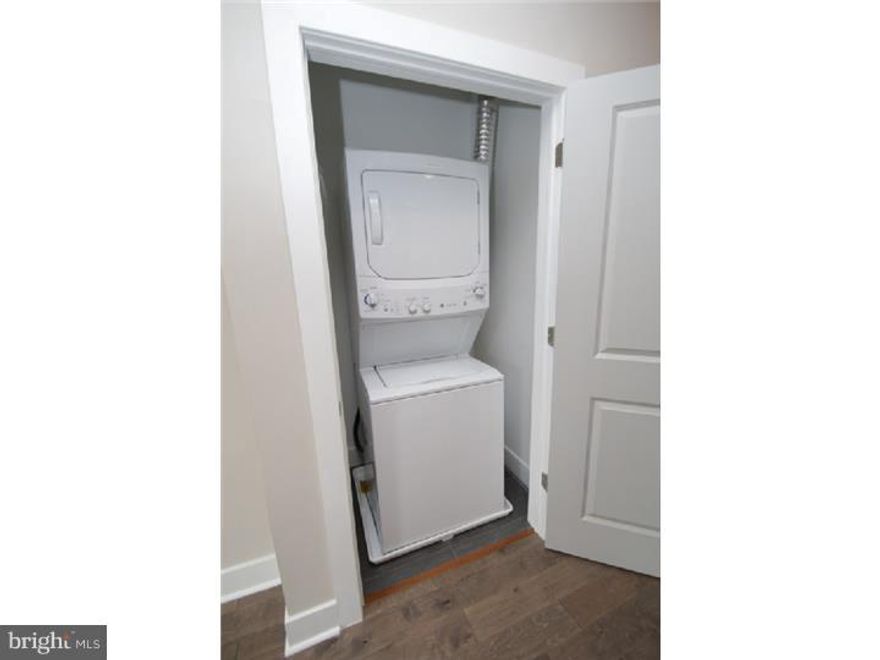 Gorgeous condo unit located on second floor of this unique rehab. Entry into common vestibule area. This unit is located on the 2nd floor. Enter into modern eat in kitchen with island center and seating for 2-4. Quartz counter tops, abundant cabinet space, stainless steel appliances, gas cooking,pantry for additional storage. Washer/dryer are located next to kitchen for convenience. Full bathroom with all the modern amenities such as ceramic tile floor and tub/shower. Good size bedroom with large closet. Back door leads out to yard with EP Henry brickwork. 2nd floor features large master bedroom and hall bath with all the updated amenities! Ceramic tile floor and tub/shower, Double closet. Third bedroom with tons of closets and storage space. Recessed lighting. Storage areas are large and located t/o the unit. Plenty of windows to allow for awesome views and light. Walking distance to many attractions and public transportation.