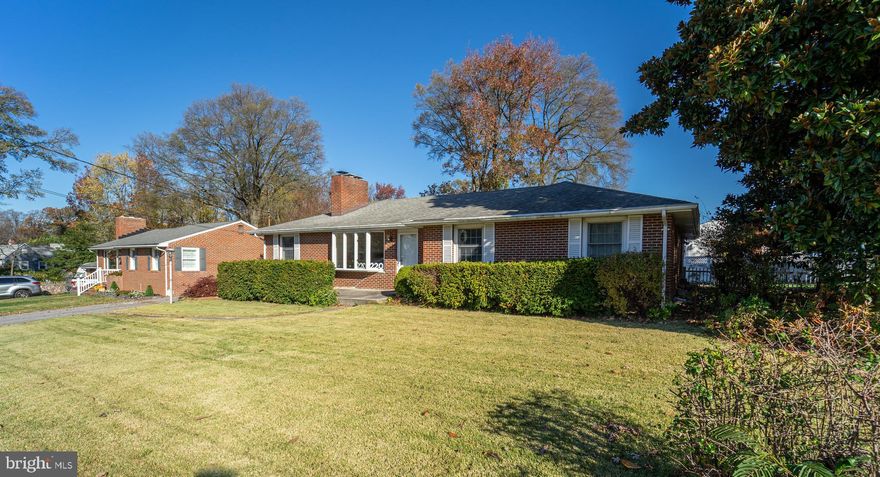 HERE YOU GO! THIS IS THE ONE YOU HAVE BEEN WAITING FOR. ALL BRICK RANCHER  WITH FOUR BEDROOMS AND DETACHED GARAGE.FEATURES OLD WORLD CHARM  WITH SOME MODERN UPDATES.SPACIOUS OPEN FLOORPLAN WTH GLEAMING HARDWOOD FLOORING THROUGHOUT MAIN LEVEL. LOTS OF SUNLIGHT AND BAYWINDOW.UPDATED KITCHEN WITH CENTER ISLAND,GRANITE COUNTERTOPS AND DINING AREA .ALSO INCLUDES SUNPORCH AND MUD ROOM OR  BONUS ROOM. MAIN LEVEL BATH HAS UPDATES WITH DOUBLE SINKS AND VANITY.LARGE LOWER LEVEL WITH BEDROOM AND OVER SIZED  UPDATED BATH AND FAMILY ROOM.GREAT FOR GUEST,HOME OFFICE OR ENTERTAINING!ENJOY THE OUTDOOR PATIO WITH ADDITIONAL PARKING PAD LOT #218 IS INCLUDED.THIS HOME IS READY FOR YOUR FINISHING TOUCHES.SELLER OFFERING ONE YEAR HOME WARRANTY.A MUST SEE.