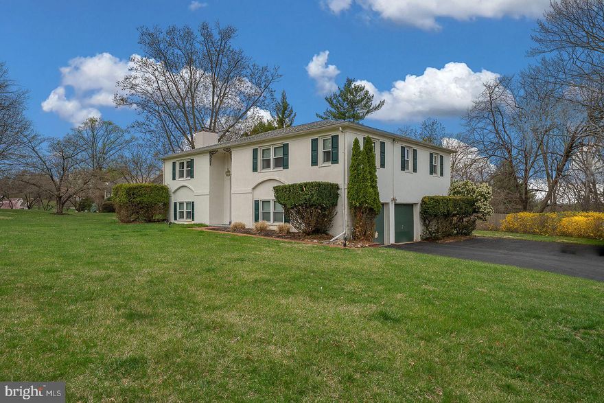 Welcome to 104 Beacon Drive East – a beautifully maintained bi-level home in one of Phoenixville’s most desirable neighborhoods.
Situated on a generously sized corner lot just over half an acre, this 4 Bedroom, 2.5 Bath home offers space, comfort, and opportunity to make it your own. The flat front and rear yards are ideal for play, gardening, or entertaining, with a charming patio surrounded by lush specimen shrubs, mature trees, and thoughtful landscaping.
Inside, you'll find hardwood flooring throughout the main level, a cozy Living Room with a fireplace and tinderbox, a formal Dining Room, and a bright, eat-in Kitchen featuring a pantry closet. The spacious Primary Bedroom includes an upgraded vanity in the ensuite Bath, and three additional Bedrooms share a Full Hall Bath to complete the upper level.
Downstairs, the inviting lower level boasts a warm and inviting Family Room with a second fireplace and a stylish wet bar—perfect for entertaining or relaxing. A Bonus Room with sliding doors opens to the backyard patio, while a Powder Room, Home Gym/Exercise space, and a large Laundry/Utility Room add convenience and versatility. Engineered hardwood floors have been recently added to the lower level hallway, and inside access to the oversized Two-Car Garage makes day-to-day living easy.
Additional upgrades include a newer roof, and thoughtful enhancements throughout.
This home has been lovingly cared for over the years and is ready for its next chapter—waiting for new owners to add their personal touch and make it truly their own.