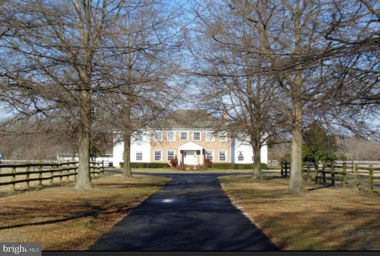 Beautiful tree lined and paved driveway that leads to a colonial style 5 bedroom/4.5 bath estate. This home sits on 7.43 acres . This estate is situated off of the well established and sought after area of Pemberton Dr. The home features a 2 story foyer with a grand staircase and marble flooring, a formal dining room, family room with fireplace, kitchen with granite countertops and stainless steel appliances and includes a casual dining area with an additional fireplace and window seat, a front office/library where there is a wet bar that is accessible by opening a door in this room as well as another door in the casual dining area for easy entertaining. There is a first floor bedroom with private bath and additional half bath on main floor. There is an additional rear staircase in the kitchen for easy upstairs bedroom access. The second floor features a master bedroom with two closets - one of them being a cedar closet, private bath and private balcony that overlook the backyard. There is an additional 2nd floor bonus room currently used as a bedroom with an additional private balcony, and additional bedrooms and bathroom. Off the kitchen is a spacious patio that leads the way to the horse stable and backyard. This property features a 5 stall horse stable - one stall is 12x18, four stalls are 12x12, and a 12x6 stall that can be made into a 12x18 by combining it with a 12x12. The barn also offers a tack room. There is a 10x16 shed that was used as a former equestrian store. Recent solar panels we're installed and lease will be transferred to the new owner.