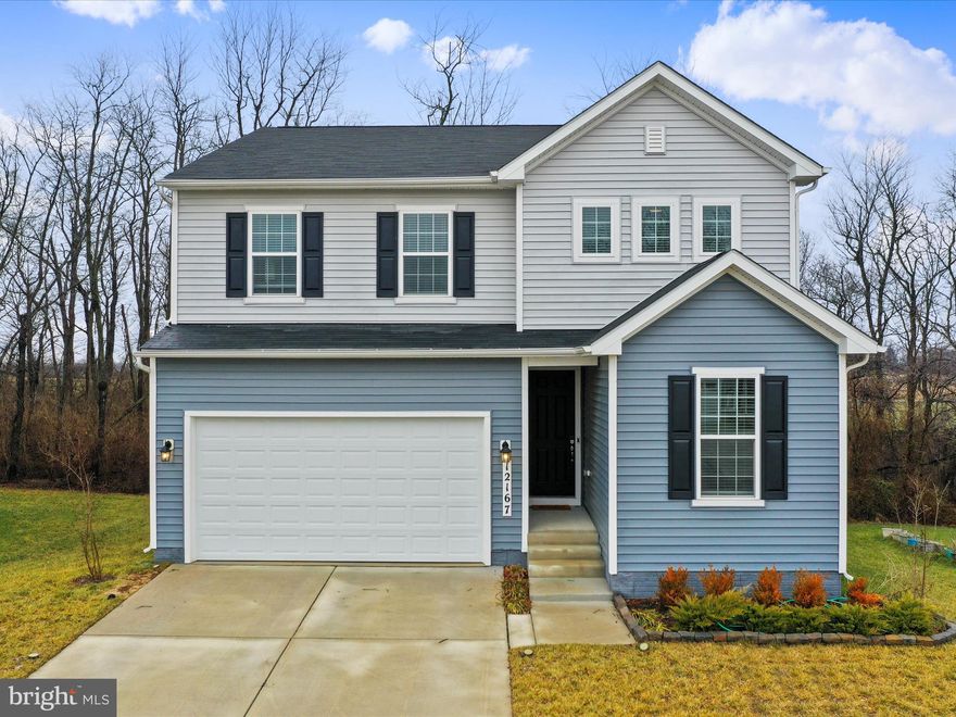 Look no further! This meticulously maintained, barely lived in, like new 4 bedroom/3 full bathroom home in sought after Hagers Crossing neighborhood is now awaiting new happy homeowners. Features include a large main level bedroom, full bathroom with easy walk-in shower, stunning gourmet kitchen, huge living room, and maintenance free Trex-deck overlooking trees and fields. Second floor spacious loft area would make the perfect office or hobby area, large bedrooms with plenty of closet space, primary bedroom with a huge walk in closet and private bathroom featuring all the bells and whistles. Laundry conveniently on bedroom level. Full, 1,113 sq. ft. unfinished basement is a clean slate ready for your finishing touches. It is already plumbed for a full bathroom and has a ground level walk-out to the private patio.  There is plenty of space for a fifth bedroom, full bathroom, and a huge family room/recreation room that would make the perfect in-law suite or guest accommodations. The oversized attached two car garage has an 8-foot garage door, extra high ceiling, and comes already equipped with an EV charging station. There are so many amenities such as walking/jogging trails, pool, tennis and basketball courts, picnic pavilion, and children's playground/tot lot. There is something for all to enjoy! Don't wait months for new construction, this gorgeous 3 year old home is available now, completely move in ready and shows like new. Ideal commuter location within a mile to I-81, minutes to I-70 and the Maryland and PA state lines, and only 35 minutes to Frederick and the MARC train station. Close proximity to shopping, restaurants, and downtown Hagerstown featuring the historic Maryland Theatre and Meritus Ballpark. Don't miss your opportunity. Get ahead of the spring market rush and schedule your showing today!