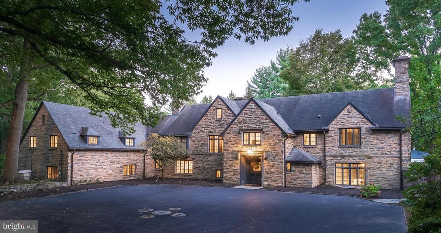 Graciously sited and accessed from a private meandering driveway sits a 1930 Cotswold-styled Manor Home custom built by the renowned Irvine and Durham.  The country estate is situated in a most private setting on four breathtaking acres featuring multiple outdoor living spaces, lovely in-ground pool, complimented by pool house, tennis court (recently resurfaced), tiered lawns and gardens and entirely accented by matured landscaping; perfectly suited for any nature lover at heart. The home’s interior is grand yet inviting and reflects architectural richness, craftmanship and charming details reminiscent of a bygone era.  The home has undergone extensive renovations by the current owner including but not limited to a custom-designed and well-appointed chef’s kitchen featuring painted inset wooden cabinetry, commercial-grade appliances (Sub-Zero and Wolf), a large center island, soapstone and Carrara marble countertops,  all accented by two Shoenbeck crystal chandeliers. Other noteworthy improvements include a new multi-zone heating system with integrated/on-demand hot water, many windows professionally restored, new custom-made carriage doors for garage, new whole house generator (Owens Cummings),  waterproofed basement and epoxy coating to basement floor (post asbestos removal), WIFI throughout house. The first floor offers a gracious and inviting Entry Hall with lovely fireside Living and Dining Rooms, both with an abundance of windows to allow stunning vistas from inside.  Elegant and classic Sunroom with stone floor, new Kitchen and butler's Pantry with adjacent Family Room.  Front and back staircases access second floor featuring five well-proportioned bedrooms as well as a series of three bedrooms in the rear wing, fully functional for household staff.  The second floor is serviced by four full baths.  The third floor features an additional bedroom complete with bath and storage.  Property is perfectly situated near historic Gladwyne Village, offers terrific award-winning Lower Merion Schools and allows for easy commuting to Center City and airport as well as a host of shopping and dining destinations either in town or along Philadelphia’s desirable Main Line.  A Town & Country setting awaits next lucky homeowner.