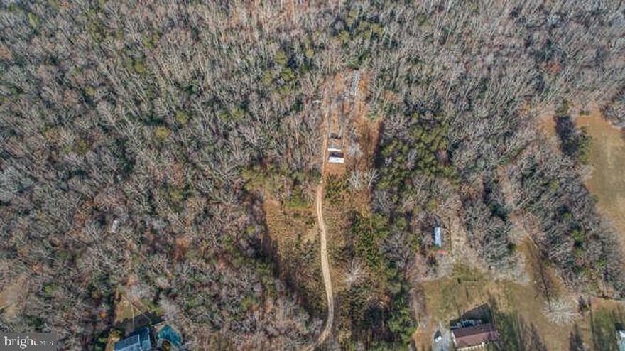 Come build your dream home on this beautiful 10 acre lot. You may even be able to divide the property into three lots.   There is an existing well and septic on property.  Please DO NOT go to property without an appointment. .  **** SHOWINGS BY APPOINTMENT ONLY****