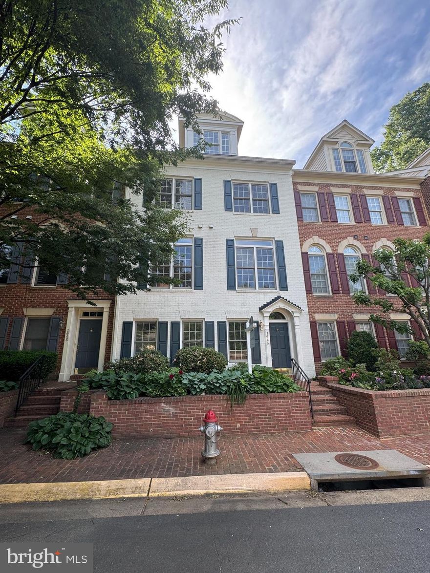 Ideally situated near the Beltway, McLean Metro, Tysons Corner, shopping, and dining, this impressive 4-level townhome offers both luxury and convenience. Enter the main level to marble flooring and a cozy fireplace that sets the tone for elegant living. The second level features gleaming hardwood floors, a bright living room with a walk-out balcony, and space perfect for entertaining. On the third level, you'll find generously sized bedrooms, each with hardwood flooring and en-suite bathrooms for ultimate privacy. The top floor boasts a private bedroom, loft area, full bath, and access to a stunning rooftop deck—perfect for relaxing or entertaining under the stars.