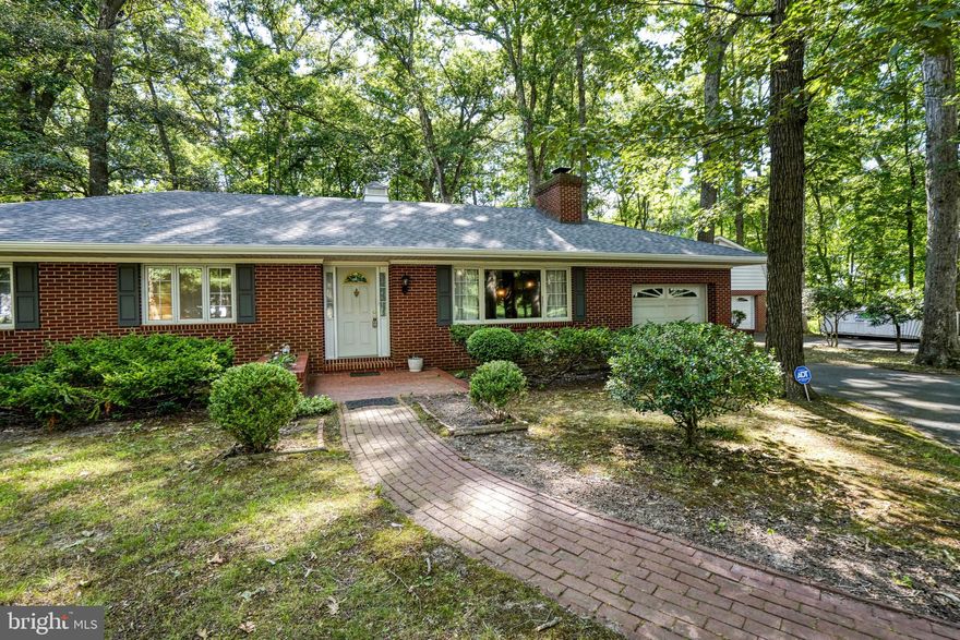 Well-built rancher situated on over 2 private acres. Recent upgrades include new well, roof, AC, oil furnace and flooring upgrades in most areas. 3 generous bedrooms and 1.5 baths. Large living room with woodstove. Eating area off the kitchen and large sunroom with radiant floor heating overlooking a large rear yard with mature trees. There are 2 detached structures:  one is a pole barn 16x22 and the other is a 2-story barn with a workshop and garage bay with a walk-up attic for storage.