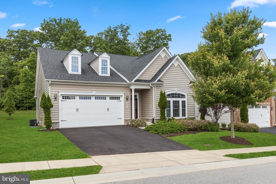 Popular NV Armistead floorplan with lovely, screened porch located on a premium lot backing to woods.  Enter the sun filled foyer showcasing beautiful hardwood flooring and transom window.  Perfect for more intimate gatherings, the dining room is detailed with accent molding and a tray ceiling.  The bright and airy open concept living area includes a great room, a spacious granite kitchen and breakfast room with access to the screened porch and backyard.  You’ll love preparing your favorite meals in the spacious kitchen that offers a large island with a sink and dishwasher, and breakfast bar, granite countertops, 42 in. cabinets, tile backsplash, and a large pantry.  Sleek stainless appliances include a wall oven, gas cooktop and refrigerator with icemaker and water dispenser.  The primary bedroom suite has a walk-in closet, and an en suite luxurious bath complete with dual granite vanities, and an oversized glass enclosed shower with seating and two shower heads.  Two sizable bedrooms, and a second full bath are located on the main level.  The lower level provides a finished recreation room, a full bath, and abundant storage space.  Entertain on the spacious screened porch showcasing a shiplap ceiling with recessed lighting and custom shades, and enjoy the many amenities that Waverly Woods has to offer including a swimming pool, clubhouse, sports courts, and more!