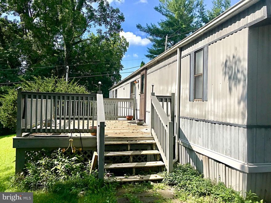 Clean, affordable housing in a rural location! Private master bedroom suite with plentiful closet space, second bedroom has private access to second bath. Also includes an office space and a bonus room to store hunting and fishing gear or excellent space for a craft room. This home is designed with an open floor plan and a breakfast bar in the kitchen. Relax on the deck or on the private patio. This property also includes a storage shed and gardening shed.