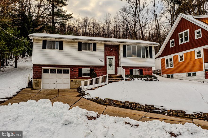 This charming bi-level stands out with its clean and classic appearance. The design offers a sense of space and functionality.

As you approach the house, you're greeted by a timeless and inviting look. A prominent feature is the attached one-car garage, providing convenient parking and additional storage space.

Upon entering the house, you step into a foyer with ceramic tile flooring, offering durability and easy maintenance. The lower level is dedicated to a bedroom, a half bath, and a large rec room, making it a cozy and comfortable space.

Ascending the stairs to the second floor, you're welcomed by beautiful hardwood floors that flow seamlessly throughout the entire level. The living space is intelligently designed, with an open concept connecting the living room, kitchen, and dining area. The kitchen is modern and functional, equipped with contemporary appliances and plenty of storage space.

The second floor boasts two bedrooms. One of them is generously sized, offering the perfect opportunity for a primary bedroom or a versatile space that can accommodate various needs, such as a home office or a hobby room. Both bedrooms on this level enjoy the warmth and elegance of the hardwood floors.

The one-bedroom on the basement level and the two bedrooms on the second floor provide a flexible living arrangement suitable for families, guests, or home office use.

This home seamlessly blends practicality with aesthetics, offering a comfortable living space with a mix of hardwood and ceramic tile flooring, an attached garage for convenience, and a thoughtful layout that caters to various lifestyle needs.