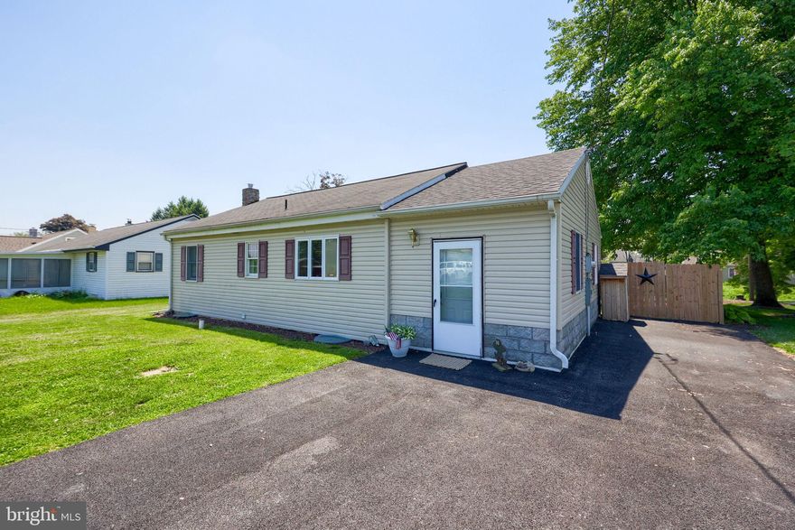 Tucked away on a quiet street in Elizabethtown School District, this ranch-style home offers comfortable one-floor living with extra space to spread out downstairs. The main level features two bedrooms, a full bathroom, and a cozy living room centered around a fireplace. The dining area overlooks the private rear yard through a large bay window, while the kitchen includes stainless steel appliances and a breakfast bar perfect for quick meals or morning coffee.

The lower level adds even more flexibility with a third bedroom, a spacious family room, and plenty of storage space. Outside, enjoy the deck overlooking the fenced-in backyard, a storage shed, and an oversized driveway with room for multiple vehicles. A great combination of indoor and outdoor space in a peaceful location.