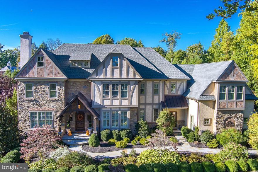 Exquisite Wayne Estate perfectly pairs elegance and comfort.  Sitting on a beautiful, lush 0.98 acre lot with private access to the Radnor Trail, this 5 bedroom, 6 full and 2 half bath, 9400+ square foot home is a dream residence.  As you enter this center hall masterpiece, you will immediately notice the attention to detail put into every inch of this home including it’s high ceilings, gorgeous crown moldings and wainscoting, and random width hardwood floors with inlay that flow into the formal living and dining rooms.  The heart of the home offers an open floor plan with fabulous family room boasting vaulted ceilings, exposed beams, gas fireplace and incredible walk up bar perfect for entertaining family and friends.  From here the gourmet chef’s kitchen showcases marble counters, large center island with prep sink, top of the line appliances, 6 burner commercial range, 2 dishwashers, Thermador refrigerator/freezer with cabinetry paneling, beautiful arched serving window to the breakfast room and door to a separate patio for barbequing and dining al fresco.  Center hall leads to a 2nd tranquil, large, stone patio with a view of the quiet grounds  and the quiet office/library with stunning built-in bookshelves and separate doors to the backyard.  Two first floor half baths, homework nook and mudroom with cubbies complete this level.  Retreat to the second floor primary suite, complete with a tray ceiling, walk-in closet, and an indulgent, primary bath with luxurious soaking tub, separate vanities and an oversized muti-head, steam shower.  In addition, there are four large bedroom suites with walk-in closets and full baths, and a convenient laundry room. The finished lower level with wet bar area including beverage refrigerator, icemaker, wine cooler, dishwasher and seating sits just off the private screening room creating a wonderful space for hosting movie night.  You will also find a sitting area with gas fireplace, exercise room, full bath and additional space to make your own.  Full house generator, multi-camera security system, sprinkler system, automatic water shutoff, Geothermal, 3-Car garage with Tesla charger, and space to install a future elevator are just a few of the extra amenities this home offers.  Located in the Award Winning Radnor School District.  Close to schools, parks, public transportation and downtown Wayne, this home truly has it all!