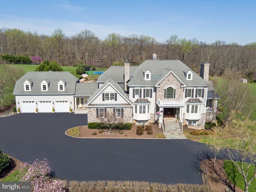 Gorgeous Estate Home, almost 10,000 sq ft, perched high on over 22, fully landscaped acres. Views of Reston and Tysons, yet totally private!!.6 bdrms plus private in-law ste w/kitchen. Hdwd flrs main level. New carpet upper/lower levels. Nanny suite w/full kitchen and bath in fully fin w/out bsmt, incl gym w/sauna. 1000 bottle wine cellar. Spectacular in-ground pool plus tennis/sport court.