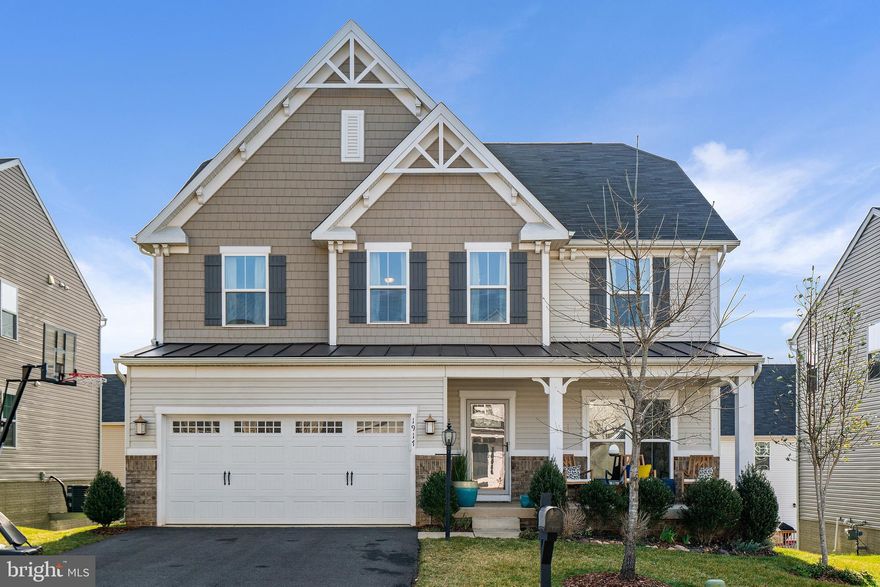 OPEN HOUSE SATURDAY 3/27 1-3 P.M. - Come check out this amazing home this Saturday from 1-3 P.M. - Absolutely stunning colonial with 5 bedrooms and  4 1/2 bathroom - nearly 4300 sq/ft of finished living space - great curb appeal with front porch, bump-outs that give a great look to the front façade, metal and shingled roofing, columns, perennial flower beds, and more - bedroom and full bath in basement with walk-in shower - large multi-purpose rec room with built-in speakers - walk-out basement - beautiful hardwood flooring - large gourmet kitchen with oversized island for hosting, cooking, dining and entertaining - custom touches throughout to include paint, fixtures, fireplace mantle and more - it's really too much to capture so you need to see it for yourself - bright and vibrant sunroom off the kitchen - large open concept on first floor is ideal for families of any size - main floor office just off the living room or use as bedroom if needed - large and spacious bedroom upstairs - a master suite that will satisfy all your needs - a loft that can serve your family in innumerable ways - all this located in a community with walking trails, parks, walking distance to downtown where everything is at your fingertips - don't wait till it's too late!