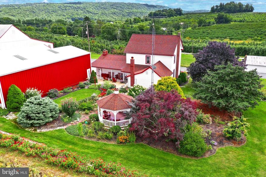 24.11 Acres featuring 2 Houses!  OWNER FINANCING AVAILABLE FOR QUALIFED BUYERS!  (with a great interest rate). Farm includes a  2744 sq.ft. farm house featuring 3 bedrooms, 1.5 bath, eat in kitchen, sunroom, formal dining room, hardwood flooring, living room, huge family room with brick fireplace,  and first floor laundry room.  Home offers a full basement, with workshop, walk up attic, and new electric panel.  Exterior offers front and rear covered porches, gazebo, mature gardens and detached 2 car garage.   2nd house on property is a 1 bedroom rancher (could be 2) with an eat in kitchen, large living room, first floor laundry and a 2  attached car garage.  Farm offers a 30x60 Morton building, cold storage, barn, machine shed, additional outbuildings, and black top driveways.   
Property has residential well 100' and an irrigation well 400',  2 septics with back up sites, 200 amp service and 3 phase on site.    Retired Peach orchard will be removed.