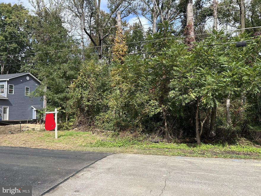 Rare 0.64-Acre Buildable Lot in Prime PG County Location

Exceptional opportunity to acquire a fully buildable 0.64-acre lot in Prince George’s County offering a private, natural setting while remaining close to key amenities and transit. This property directly borders protected parkland, ensuring permanent privacy on one side, and features mature tree coverage, a gentle slope, and excellent road frontage.

Located just over 1 mile to Branch Avenue Metro Station (Green Line) and less than a mile to the nearest bus stop and the new USCIS Headquarters. Joint Base Andrews is under 5 miles away, with easy access to commuter routes, shopping centers, and public services.

The lot is fully improved and development-ready with the following approvals and infrastructure in place:
Approved NRI (Natural Resources Inventory).
Approved TPC II (Type 2 Tree Conservation Plan).
On-site water tap installed.
Public sewer connection available on-site.
Completed soil studies.
No HOA.
Zoned for residential use.
Verizon Fiber Optic available at the pole.

The neighboring home is already under development, highlighting the strong demand and growth in the area. Due to the adjacent protected land, no future development is permitted to the right of this property, preserving long-term privacy and uninterrupted stunning views.

Ideal for a custom home or investment project. Buyer responsible for confirming all permitting requirements with Prince George’s County DPIE. All due diligence has been completed. This is a truly turnkey land opportunity.