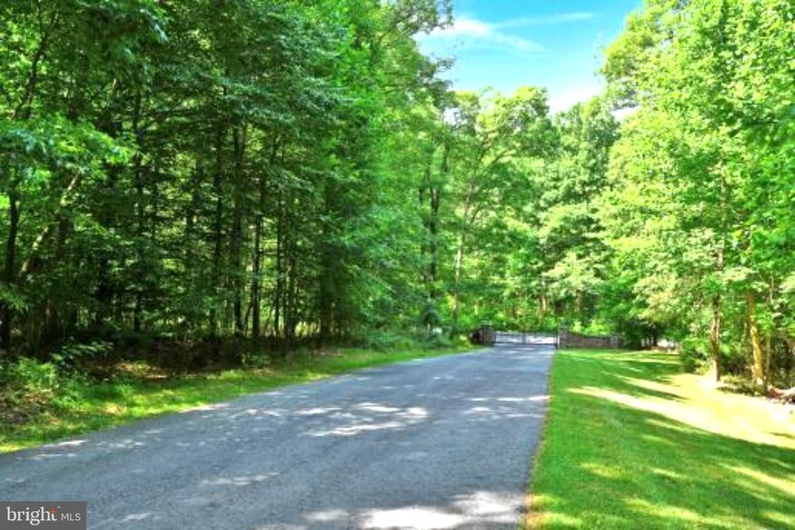 Welcome to your own personal wooded retreat, a nature lover's dream! This stunning 12.5-acre property will captivate you from the moment you drive through the gates and meander down the forested lane.   As you arrive at the sun-drenched clearing, you’ll discover a park-like yard featuring a gorgeous ALL-BRICK Colonial 4 BR 3 BA custom home offering over 4,900 square feet of comfortable living space.   Nestled against 156 ACRES OF STATE GAME LAND, this home provides the ultimate in privacy and seclusion.  Expertly constructed by Earl Weaver, it boasts efficient radiant floor heating throughout, ensuring a cozy atmosphere year-round.  Designed to create a welcoming and peaceful space inspired by the beautiful surroundings, the home ushers you in with spacious rooms with abundant windows filtering in loads of natural light.  Step inside to find inviting living and family rooms, complete with a cozy fireplace and beautiful, gleaming hardwood floors.  The large eat-in kitchen is a chef’s dream, featuring Jenn-Air double ovens, a Bosch dishwasher, stunning granite counters, and ample storage, including an extra pantry.  The first floor also includes a formal dining room, office, mudroom, laundry room, full bath, and an oversized three-car garage with built-in cabinets and a utility sink—everything you need for convenience!   Upstairs, you’ll discover four generous bedrooms and two baths, including the luxurious primary suite, which features a jacuzzi tub, a glass walk-in shower, dual sinks, and oversized his and hers walk-in closets.   Plus, there’s a bonus room—perfect for an office, nursery, or relaxation space.  The expansive unfinished basement, with poured concrete walls, is ready for your personal touch and is plumbed for a bath and has direct access to the side yard.   Additional highlights include a whole house generator with a 2,500-gallon tank, ensuring peace of mind.   With beautiful hardwood and tile flooring throughout, radiant heating, and custom Emanuel Kauffman built-in cabinets, this home combines elegance with comfort.   This ideal location offers quick access to Routes 322, 72, 419, and the PA Turnpike, making commuting to Hershey, Lititz, Lebanon, and beyond a breeze.   Embrace a lifestyle of serenity and comfort in this remarkable one-owner custom home, which has been deeply cherished and meticulously maintained.  Your dream home awaits—just minutes from Mount Gretna and conveniently close to Lancaster, Hershey, and Harrisburg Airport.   For nature enthusiasts, the Lebanon Rail Trail and Mount Gretna are just around the corner.   Experience the beauty of this unique property, surrounded by lush, mature forests.  (Please see floor plans in photo section)  Come see for yourself!

**Please do not attempt to enter property without a scheduled appointment.