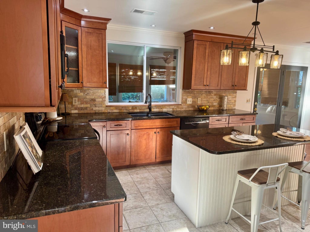 Photo of 9100 Greenwood Avenue, NORTH BEACH, MD 20714 (MLS # MDCA2031120)