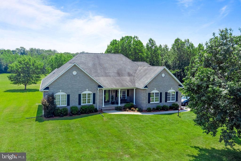 Stunning and immaculate two-story estate includes a 6,000+ sf home on 7 acres of beautiful land with mature trees and landscaping makes it a one of a kind property in this region. The spacious design of the interior rooms and outdoor setting makes this home perfect for family life and entertaining guests. The home includes high ceilings, large gourmet kitchen, two gas fireplaces, and luxury finishes that provide the baseline for the stunning views surrounding the property from inside or the back veranda that overlooks the property of this partially wooded property. This home boasts two large master/primary bedrooms with full en-suites and two additional bedrooms with full bathrooms. This house was designed to maximize light and space with vaulted living room and kitchen ceilings making it ideal for family gatherings and meals. The upper-level Brazilian cherry hardwood floors provide a rich, warm aesthetic with exceptional durability and easy maintenance. The owners recently invested in luxury finishes including designer carpet and padding throughout the entire lower living area which provides an extra layer of thermal insulation, helping to keep this home warm in the winter while contributing to better acoustics while playing a game of pool or relaxing in the home theater.
This home is located in a serene country setting just a few miles from Lake Anna making it ideal for quick boating and fishing trips on weeknights or weekends.
**Starlink internet and several satellite internet options available.**