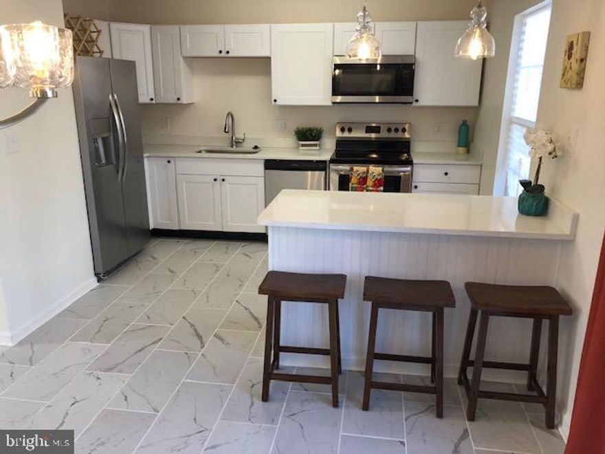 Beautifully remodeled townhouse in a great location. Two reserved parking spaces in front of the house and plenty of visitor parking. 3 bed and 2 full bath upstairs and with an open kitchen layout. New kitchen cabinets, appliances, countertops, ceramic tile floors. New bathroom tubs, tiles, vanities, toilets,.... New carpet flooring, fresh paint, light fixtures, HVAC, water heater, fenced back yard with deck  ..  Close to bus stops, Suitland metro station, and major roads.