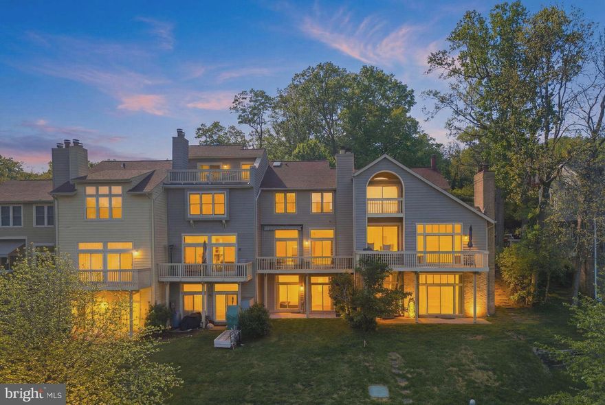 Nestled along the shores of Lake Audubon, this exceptional waterfront townhome offers a rare opportunity to enjoy serene lakeside living in the heart of Reston. Backing directly to common area and the water’s edge, the property captures breathtaking lake views from nearly every window and across all three finished levels.

Thoughtfully updated throughout, the home features a new roof, new HVAC system, and a beautifully remodeled kitchen that was reconfigured to maximize both functionality and views. The expansive chef’s kitchen is positioned at the front of the home and includes heated floors, a large center island, and an open-concept design that flows seamlessly into the main living area. The entire rear of the main level is dedicated to light-filled large living and entertaining open space with High ceilings, spaces overlooking the lake, with direct access to a spacious deck perfect for relaxing or dining outdoors.

Upstairs, the home offers three bedrooms and two renovated bathrooms, including a spacious primary suite with stunning water views and an updated en-suite bath featuring a walk-in shower.

The walkout lower level features high ceilings and a large recreation room with a cozy corner fireplace, along with a full bath and utility room. There’s also potential to have a fourth bedroom by adding a wall. From this level, you’ll enjoy direct access to the waterfront and a private outdoor space. A deck boat conveys with the property, creating a truly unique lakeside lifestyle experience.

Located just moments from South Lakes Village Center, residents enjoy easy access to restaurants, shopping, coffee shops including Starbucks, and everyday conveniences, all while enjoying the tranquility of waterfront living. These lakefront homes are rarely available, and the close-knit community atmosphere makes this an extraordinary opportunity for buyers seeking both convenience and peaceful waterfront surroundings.***Deck Boat included in Sales Price - As is, Where is.***