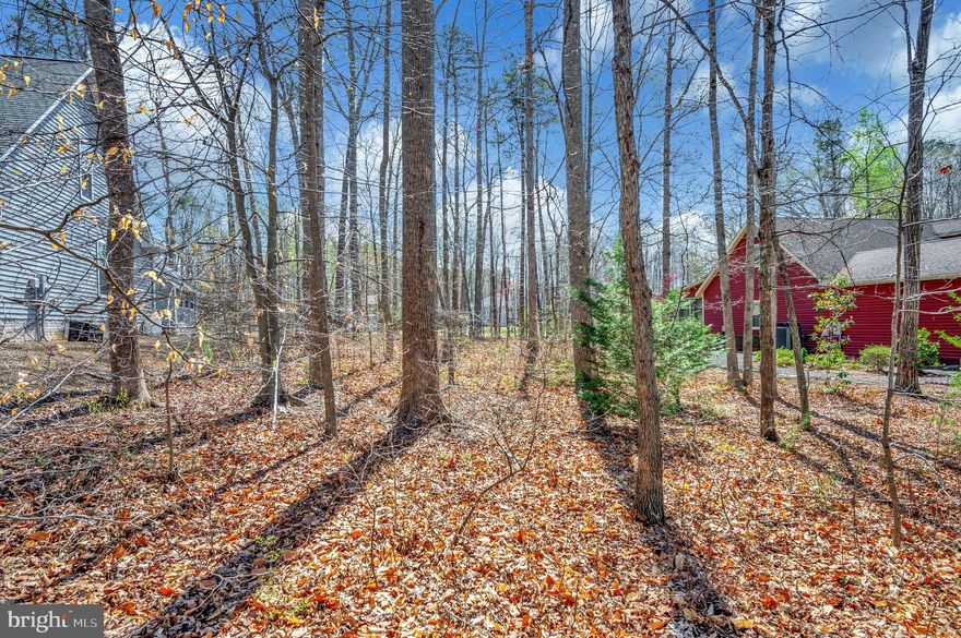 Experience the pinnacle of luxury living with this exceptional golf course lot, offering unparalleled views and direct access to the meticulously maintained fairways. Nestled within the prestigious Lake of the Woods, Lake and Golf Gated Community,  this expansive lot provides the perfect canvas to design your dream home amidst the serene beauty of rolling greens and mature landscapes.  Drive your golf cart conveniently just a short distance to the Starter House! You will be part of a Community with fun filled amenities including two Lakes, 500 acre Main Lake and 24  Acre Keaton Fishing Lake,   PGA Golf Course, 2 Restaurants -- Clubhouse and Fairway Cafe,  two Olympic Swimming Pools,  9  Beaches, Equestrian Center, Tennis and Pickle Ball Courts, Dog Park, Basketball and Baseball areas, Playgrounds, Picnic and BBQ grounds, Community Center and planned activities for holidays throughout the year.