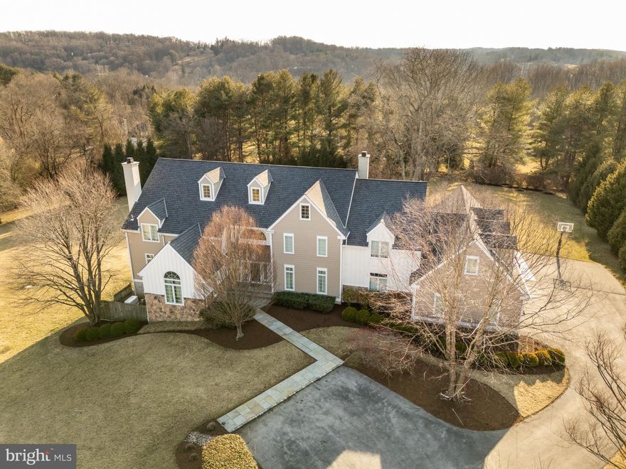Nestled in the exclusive Birmingham Estates, this breathtaking five-bedroom, four-full and four-half-bathroom home is the epitome of refined living. Set on 3.5 private acres, this hilltop estate offers stunning views, an exceptional layout, and a backyard retreat—all within minutes of West Chester’s vibrant downtown, scenic trails, and top-rated schools.

A grand stone-pillared entrance and winding driveway set the stage for this magnificent home. Inside, a three-story atrium-style staircase welcomes you with soaring ceilings, gleaming hardwood floors, and abundant natural light. Designed for seamless entertaining and everyday comfort, the open-concept layout flows effortlessly from one elegant space to the next. The grand two-story family room features vaulted ceilings and custom built-ins, while the formal living room boasts an inviting fireplace. A sun-drenched sitting room provides another peaceful space to unwind. The heart of the home is the designer chef’s kitchen, a true showstopper with custom cherry cabinetry, premium granite countertops, Wolf and Sub-Zero appliances, and an oversized island. A cozy fireplace and stainless accents add warmth, while the kitchen opens to a sunroom, dining area, and an expansive outdoor patio. Two private home offices offer inspiring views and a quiet setting for remote work.

The second floor is anchored by the luxurious primary suite, a private retreat featuring a spacious sitting area, a spa-like bath with a walk-in shower, and an oversized walk-in closet with a center island. Two additional bedrooms share a beautifully designed Jack-and-Jill bath, while a third guest suite offers a private en-suite. A bright fifth bedroom and a convenient second-floor laundry room complete this level.

The finished third floor offers endless possibilities, making it an ideal space for a home office, yoga studio, or creative retreat.

The lower level is an entertainer’s dream. The finished walkout basement includes a guest suite, a billiards area, a media space, and direct access to the backyard.

The outdoor living space is just as impressive as the interior, with an expansive stone patio, a covered pergola, and a built-in grilling station, all surrounded by beautifully manicured gardens and mature trees. Whether hosting a summer barbecue or enjoying a quiet evening under the stars, this outdoor retreat is truly exceptional. A three-car garage and a driveway basketball hoop add both practicality and fun to an active lifestyle.

With recent high-end updates, including Hardie Board siding in 2021, a new roof in 2018, and updated windows and doors in 2010, this home is move-in ready and built to last. Located in the heart of Wyeth Brandywine country, just minutes from Longwood Gardens, Radley Run Country Club, and downtown West Chester, this home offers the perfect balance of serenity and convenience.

Don’t miss this rare opportunity—schedule your private tour today!
