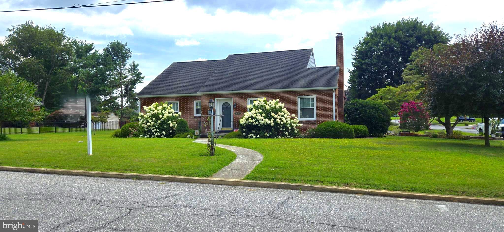 LOCATION, LOCATION, LOCATION! Beautiful Brick Rancher on corner half-acre+ lot in walking distance to shopping, schools, YMCA. Home in the Eastland Hills area has 2 finished levels with 2 bedrooms, 2.5 bathrooms, wood floors throughout the main level, newer windows and year-round sunroom. Don't miss the two-car deep (front to back), side-load garage. Move-in ready! Make it yours!